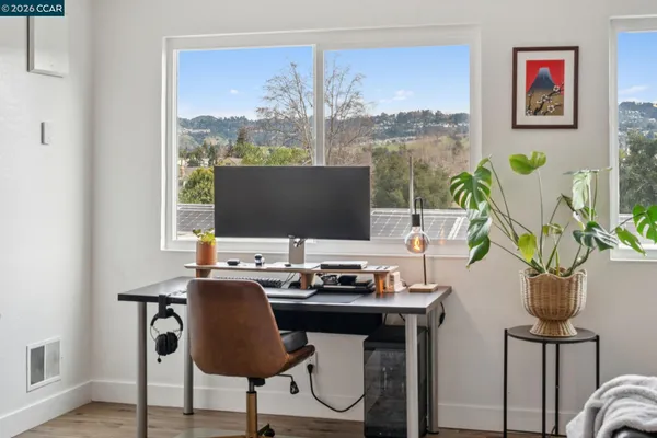 a table with chairs and a window