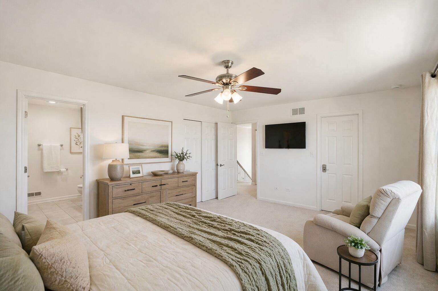 10322 Adler Cove St. John, IN 46373 - Photo 18 of 26 a bedroom with a bed furniture and a flat screen tv