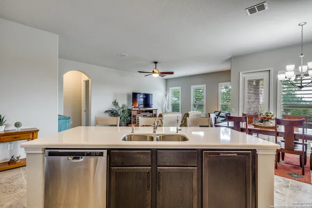 a spacious bedroom with a bed dresser and a window