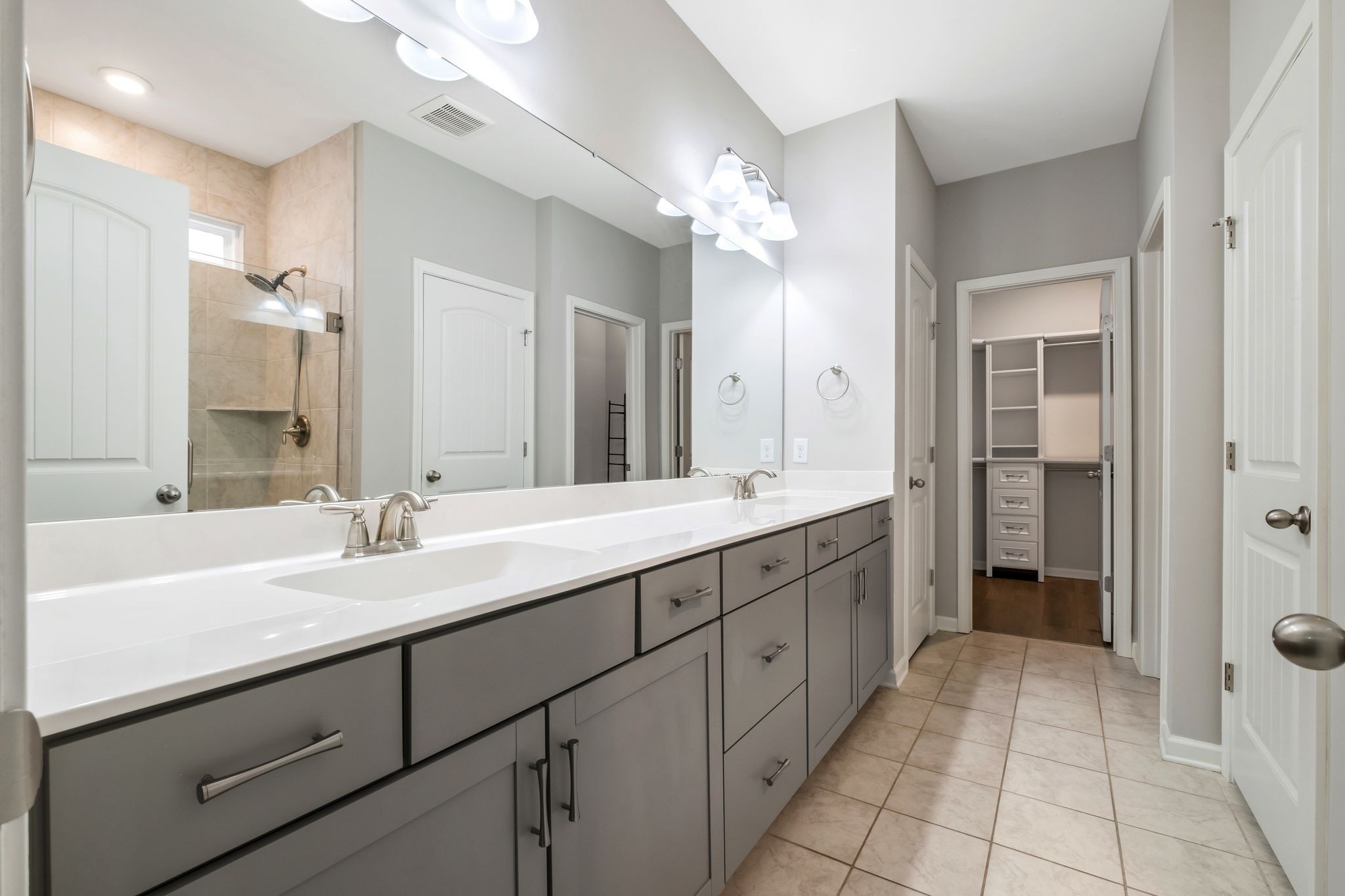 3721 Hoggett Ford Road Hermitage, TN 37076 - Photo 19 of 31 a spacious bathroom with a double vanity sink shower and a mirror