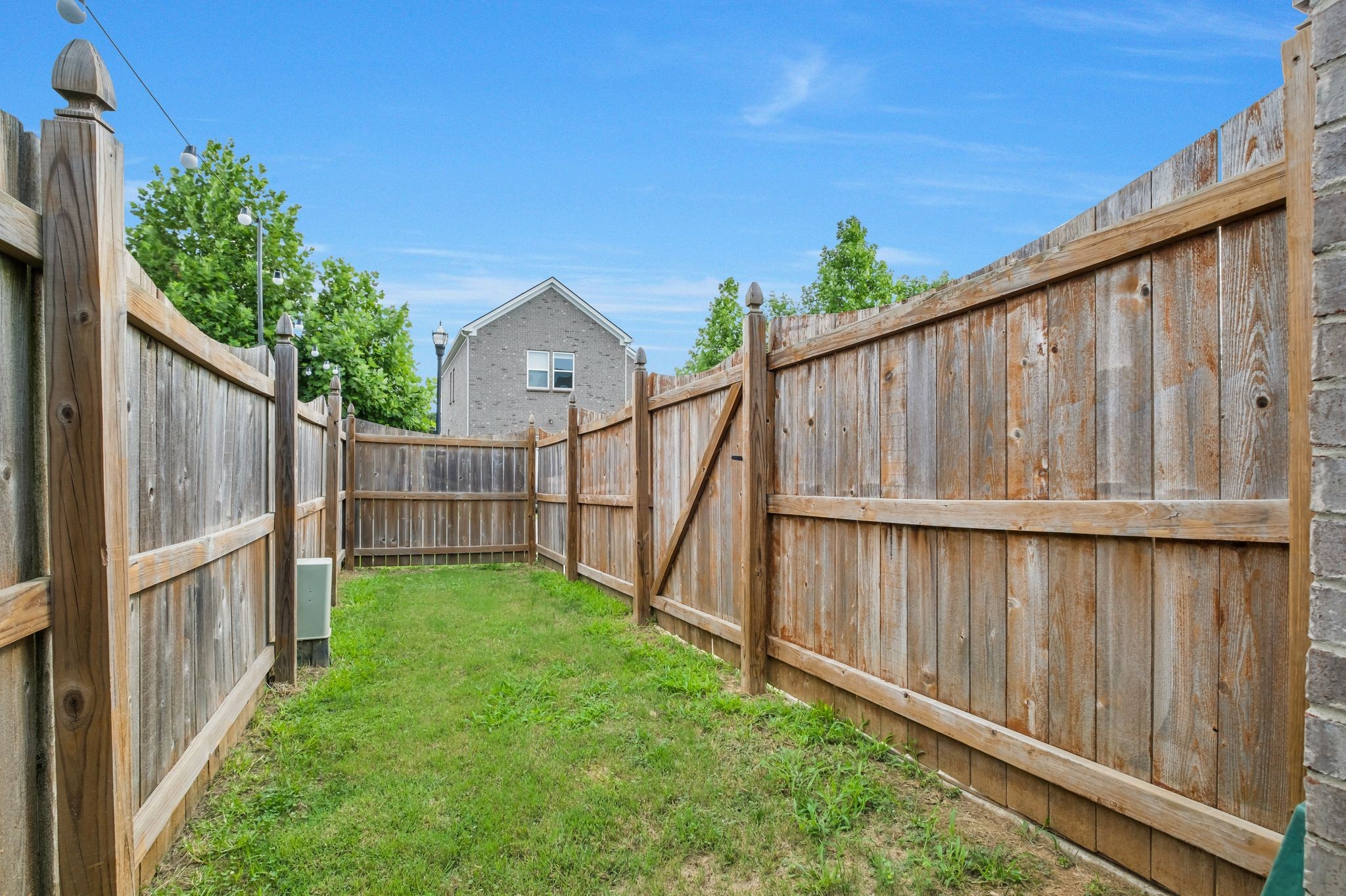 3721 Hoggett Ford Road Hermitage, TN 37076 - Photo 30 of 31 a view of backyard with wooden fence and large trees