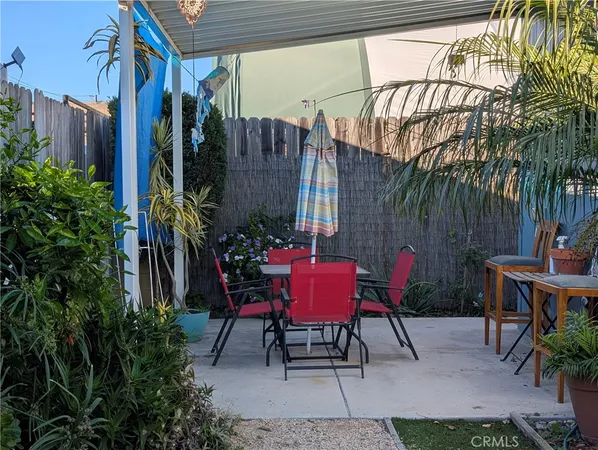 a view of a chairs with a table in the patio