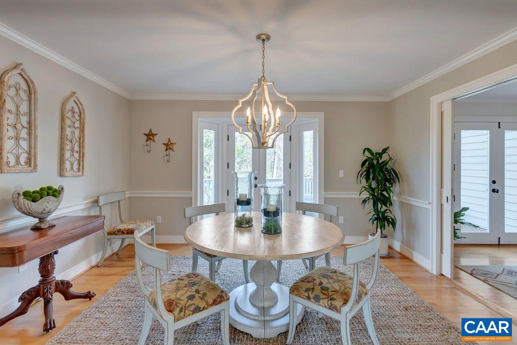 575 Grassmere Road Charlottesville, VA 22903 - Photo 10 of 50 a view of a dining room with furniture window and wooden floor