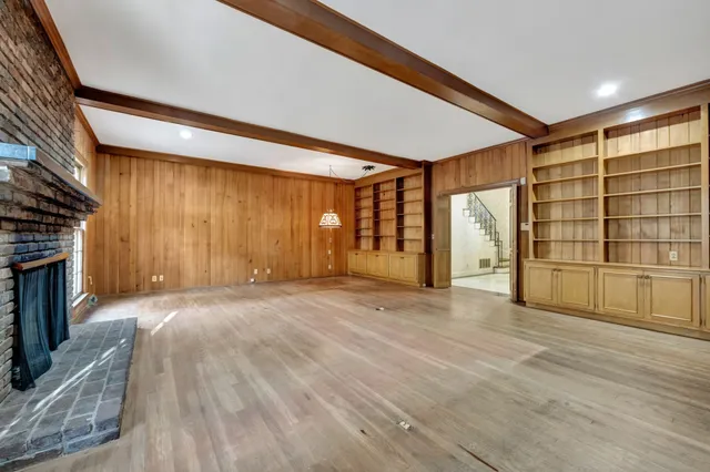 a kitchen with cabinets appliances a sink and a counter top space
