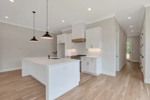 a bathroom with double vanity sink and a mirror