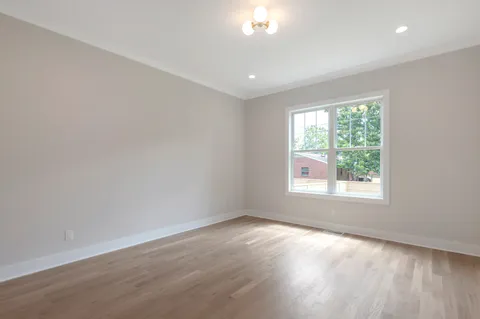 a bathroom with a bathtub and a toilet