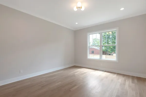 a bathroom with a bathtub and a toilet