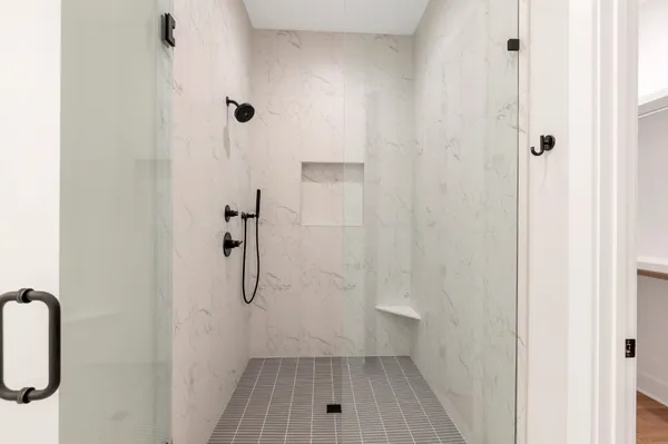 a bathroom with a sink vanity and a mirror
