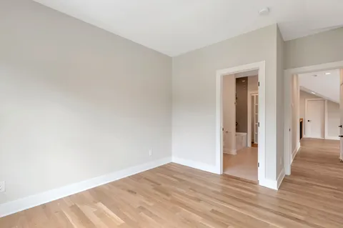 a bathroom with a glass shower door