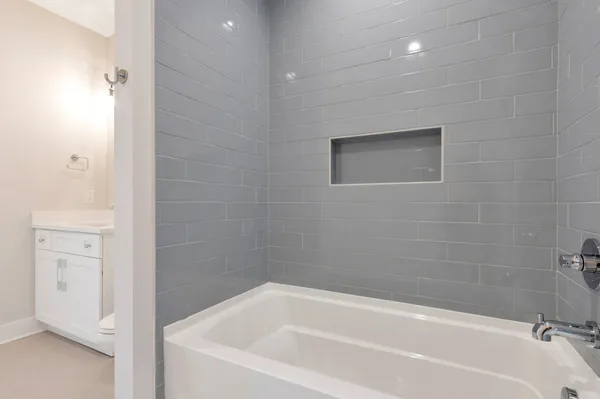 a kitchen with a sink a window appliances and cabinets