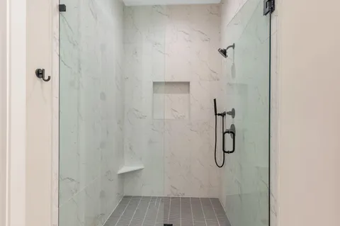 a bathroom with a sink vanity and a mirror