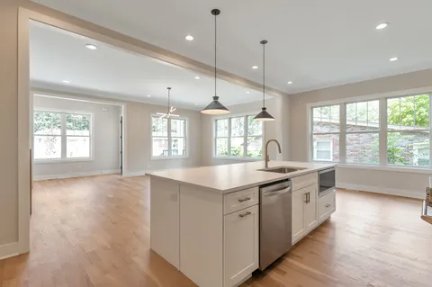 a view of a backyard with wooden fence