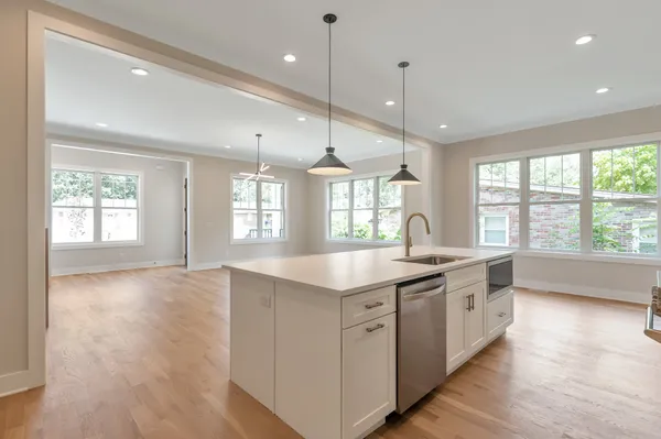 a view of a backyard with wooden fence
