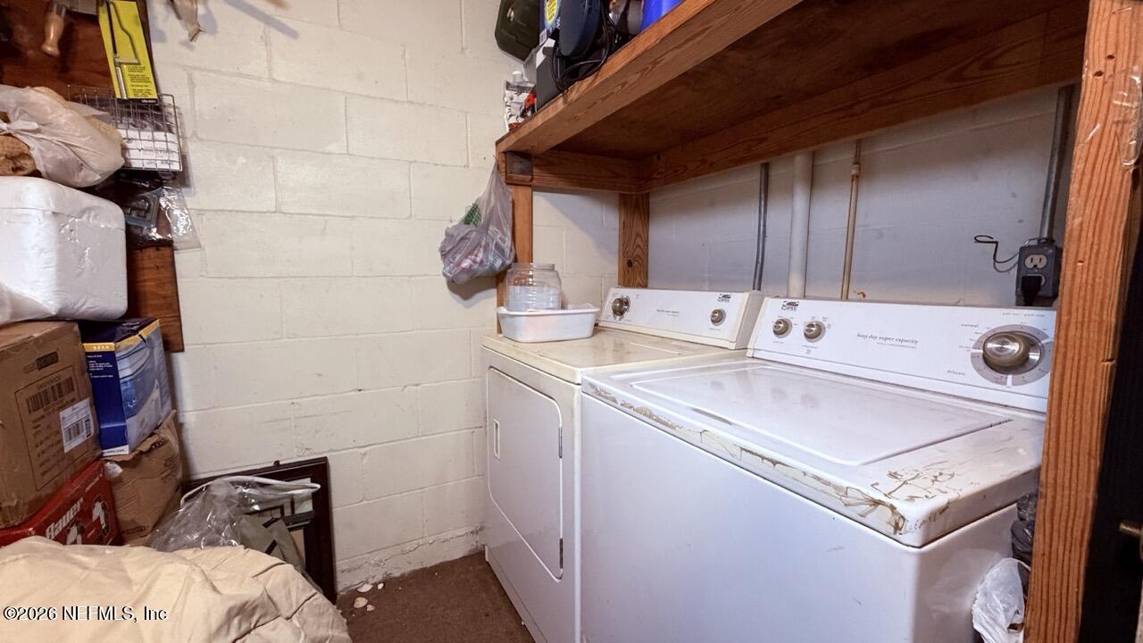 11432 Godfrey Way Jacksonville, FL 32223 - Photo 11 of 18 a utility room with dryer and washer