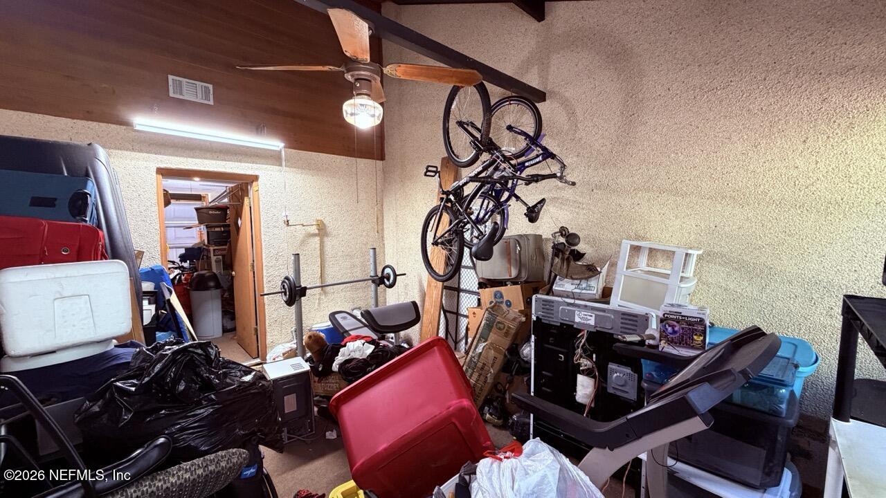 11432 Godfrey Way Jacksonville, FL 32223 - Photo 14 of 18 a view of a room with gym equipment