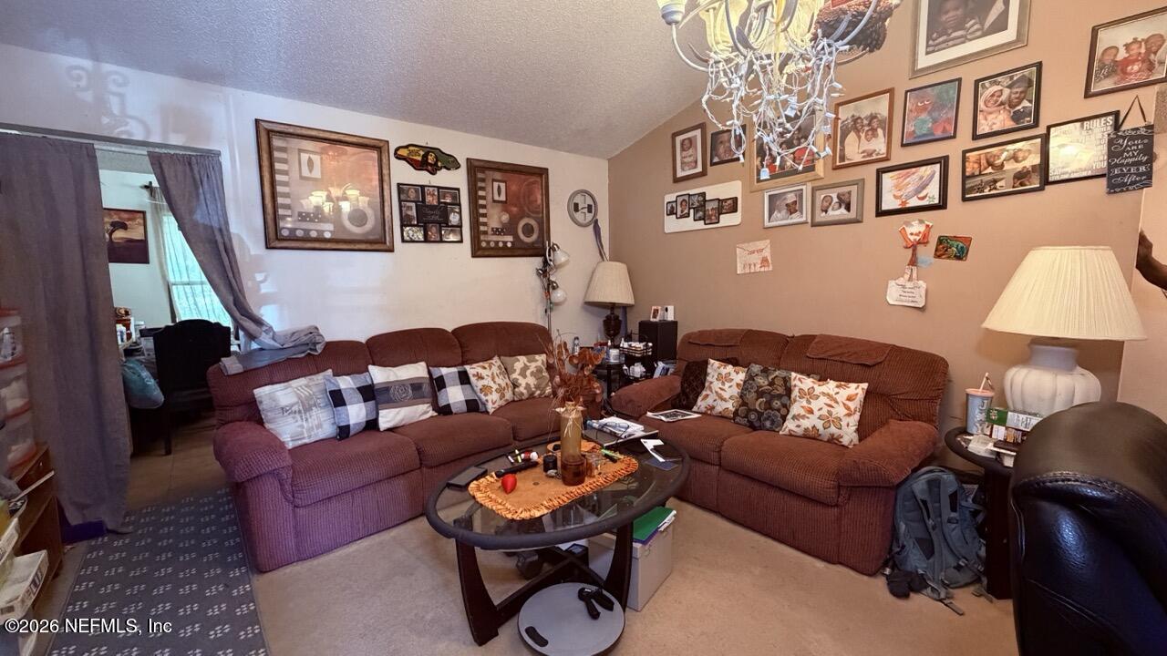 11432 Godfrey Way Jacksonville, FL 32223 - Photo 3 of 18 a living room with furniture and a window
