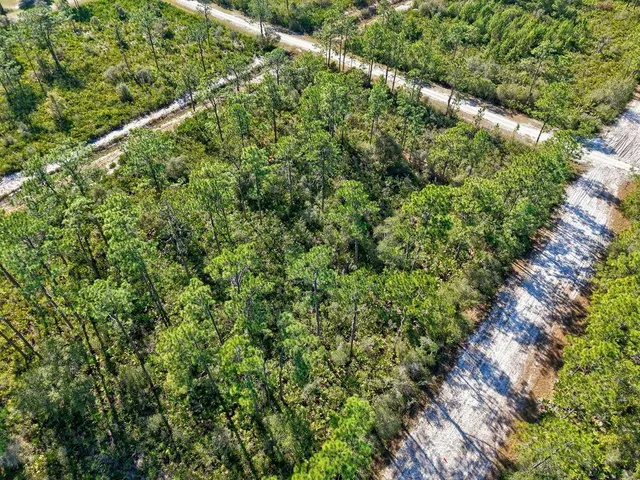 a view of a field with an outdoor space