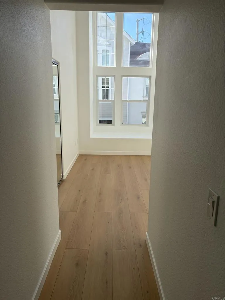 815 Harbor Cliff Way, Unit 239 Oceanside, NY 11572 - Photo 5 of 11 a view of empty room with window