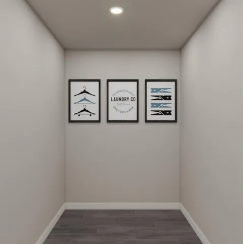 an empty room with a painting on the wall