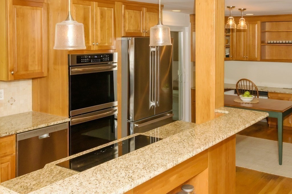 183 Littleton Road Harvard, MA 01451 - Photo 8 of 30 a kitchen with stainless steel appliances kitchen island granite countertop a refrigerator and a stove top oven