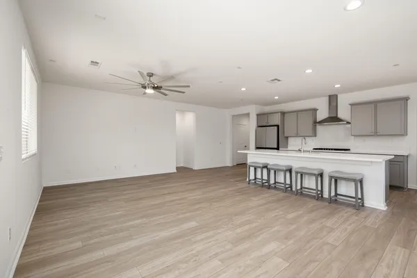 a view of a kitchen with furniture and a floor to ceiling window
