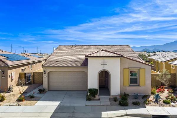 a view of a white house with outdoor space