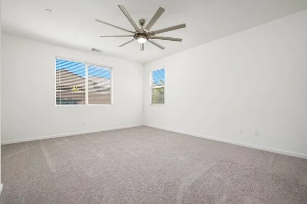 a spacious bathroom with a double vanity sink and mirror