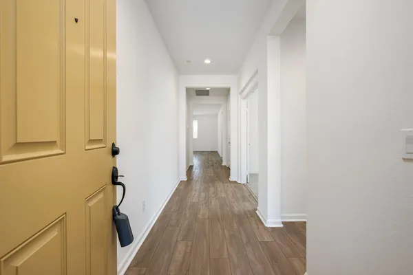 a kitchen with stainless steel appliances granite countertop a white cabinets a sink and a stove