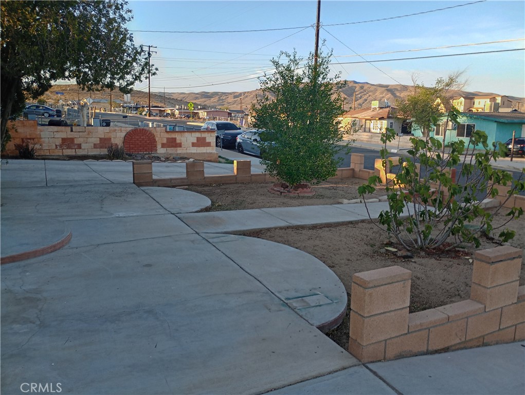 1426 Riverside Drive Barstow, CA 92311 - Photo 14 of 19 a view of a patio with couches and potted plants