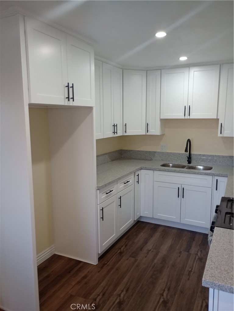 1426 Riverside Drive Barstow, CA 92311 - Photo 10 of 19 a kitchen with granite countertop white cabinets and white appliances