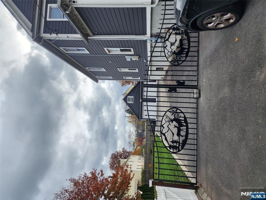 30 West 15th Street, Unit 2 Linden, NJ 07036 - Photo 2 of 7 a couple of cars parked in front of a house
