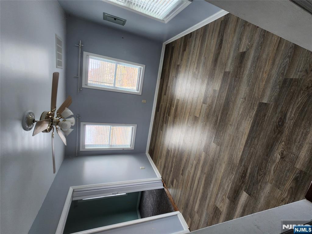 30 West 15th Street, Unit 2 Linden, NJ 07036 - Photo 4 of 7 a view of empty room with wooden floor and fan