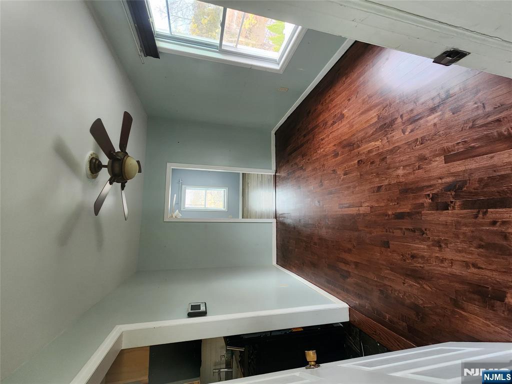30 West 15th Street, Unit 2 Linden, NJ 07036 - Photo 5 of 7 wooden floor in an empty room with a window