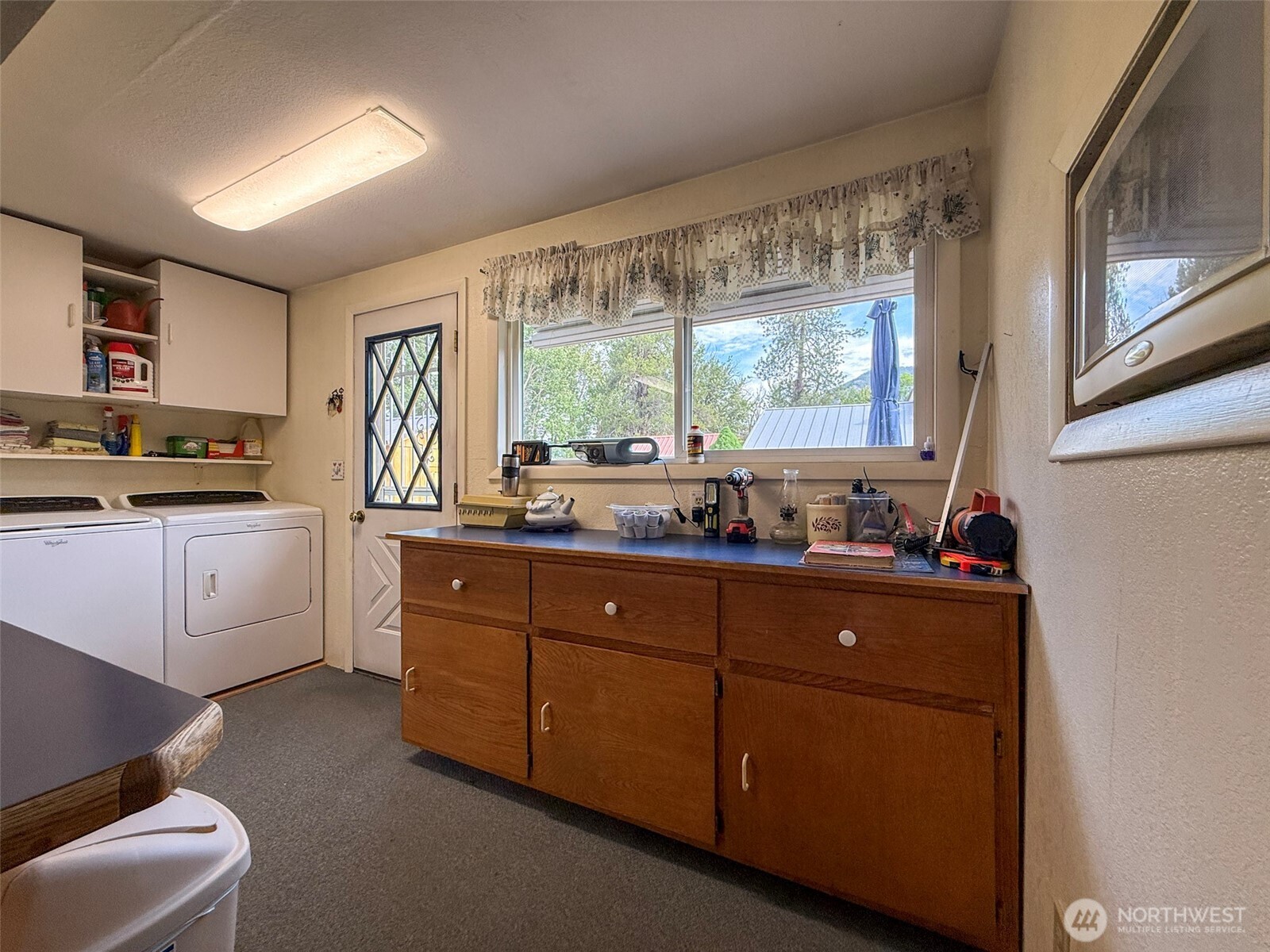 518 Bridge Street Twisp, WA 98856 - Photo 15 of 40 a kitchen with sink a window and cabinets