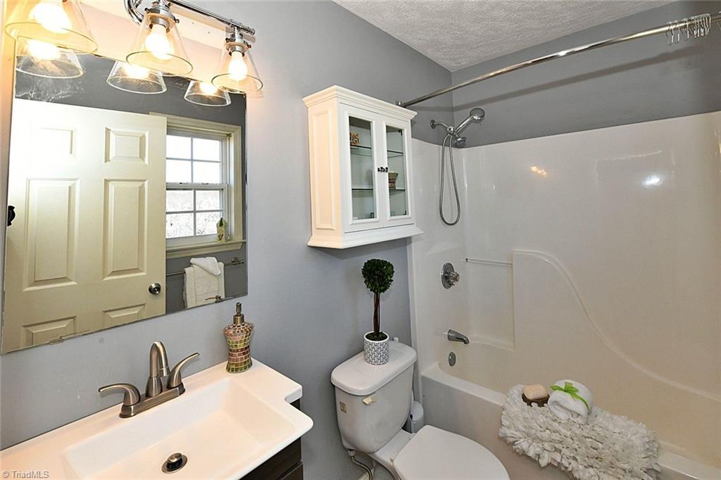 128 Lynne Avenue King, NC 27021 - Photo 11 of 27 Pretty Primary En SuiteRecent Vanity and Tub/Shower