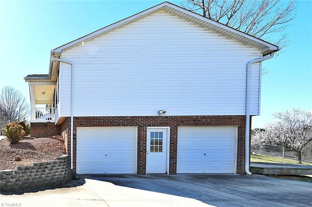 128 Lynne Avenue King, NC 27021 - Photo 21 of 27 2 Car Basement Garage with Pedestrian Door