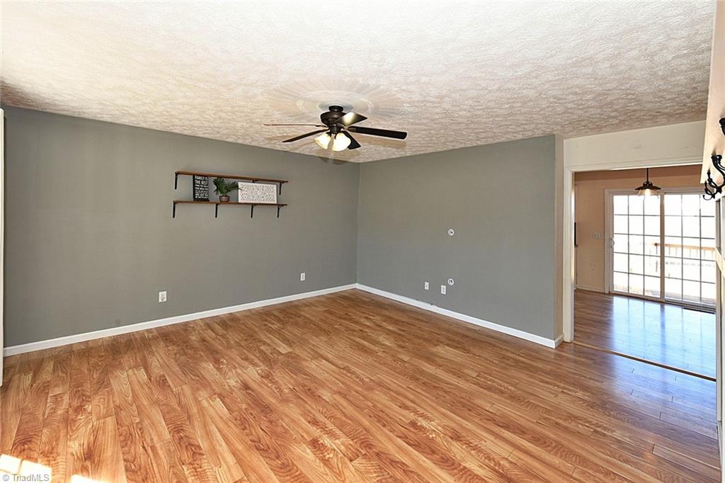 128 Lynne Avenue King, NC 27021 - Photo 8 of 27 Shelving and Smooth Flooring Throughout Home -Ceiling Fan. NO CARPET!