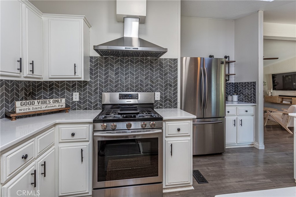27568 Ruby Lane Castaic, CA 91384 - Photo 12 of 34 a kitchen with a stove and refrigerator