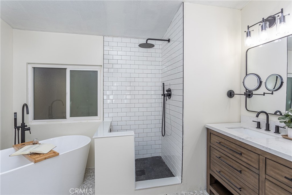 27568 Ruby Lane Castaic, CA 91384 - Photo 19 of 34 a bathroom with a sink a bathtub and a mirror
