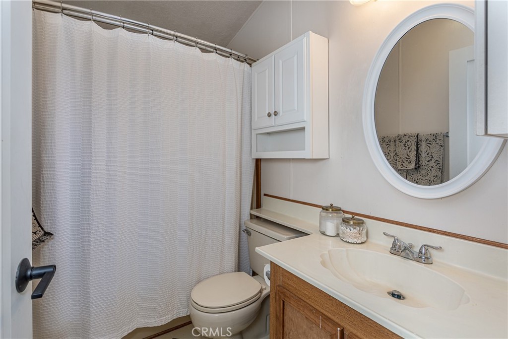 27568 Ruby Lane Castaic, CA 91384 - Photo 22 of 34 a bathroom with a sink toilet and a mirror