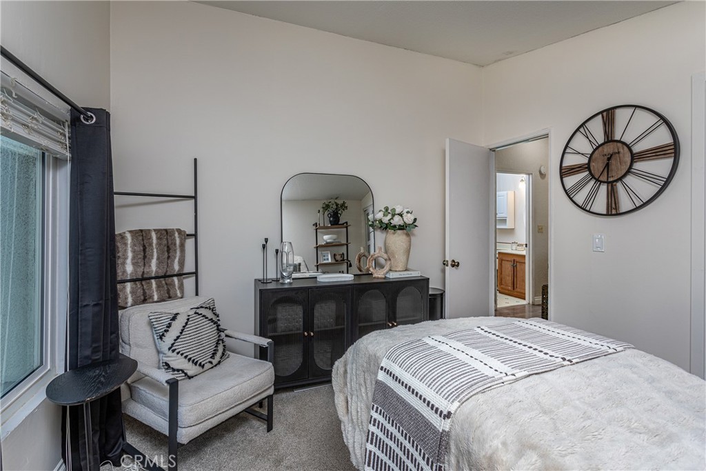 27568 Ruby Lane Castaic, CA 91384 - Photo 24 of 34 a bedroom with a bed mirror and wall paintings