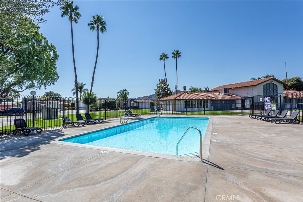 27568 Ruby Lane Castaic, CA 91384 - Photo 29 of 34 a view of swimming pool with lawn chairs and wooden fence