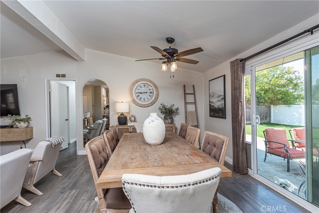 27568 Ruby Lane Castaic, CA 91384 - Photo 8 of 34 a view of a dining room with furniture a chandelier and wooden floor