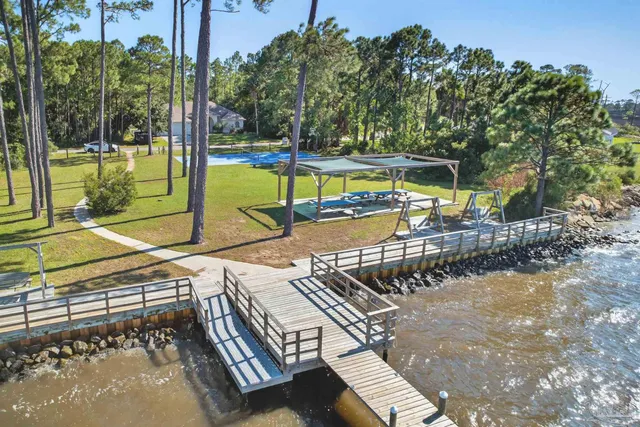 swimming pool view with a lake view