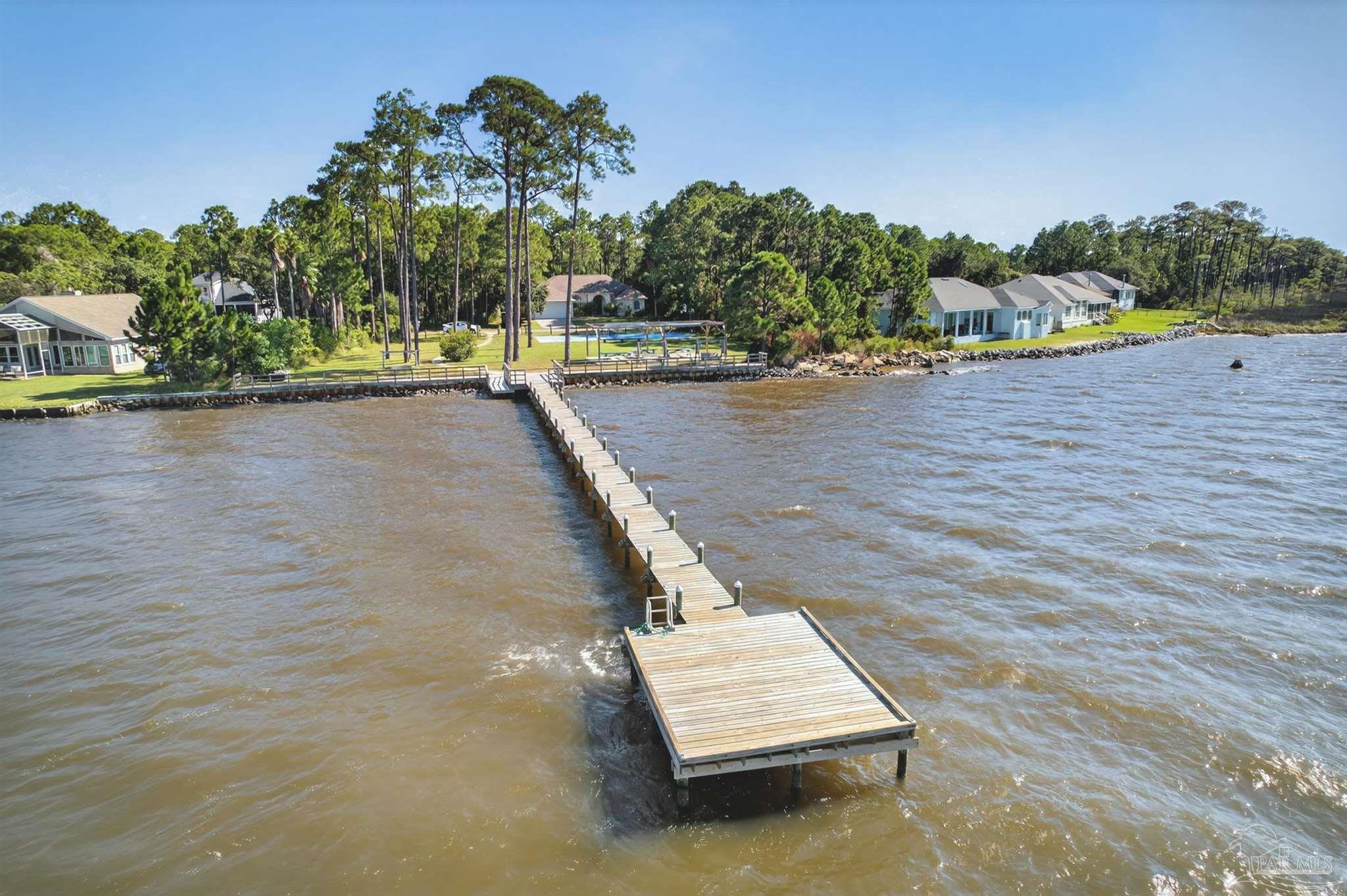 5931 Red Cedar Street Pensacola, FL 32507 - Photo 7 of 15 swimming pool view with a lake view