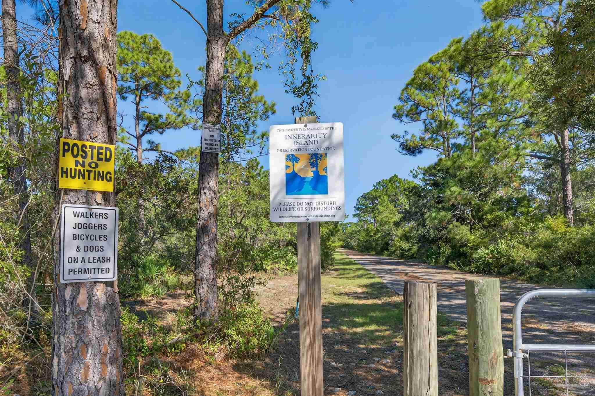 5931 Red Cedar Street Pensacola, FL 32507 - Photo 9 of 15 a sign on the side of a building