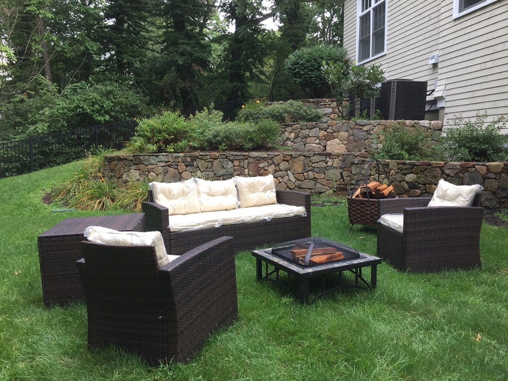 66 Arnold Road Wellesley, MA 02481 - Photo 9 of 13 a backyard of a house with outdoor seating