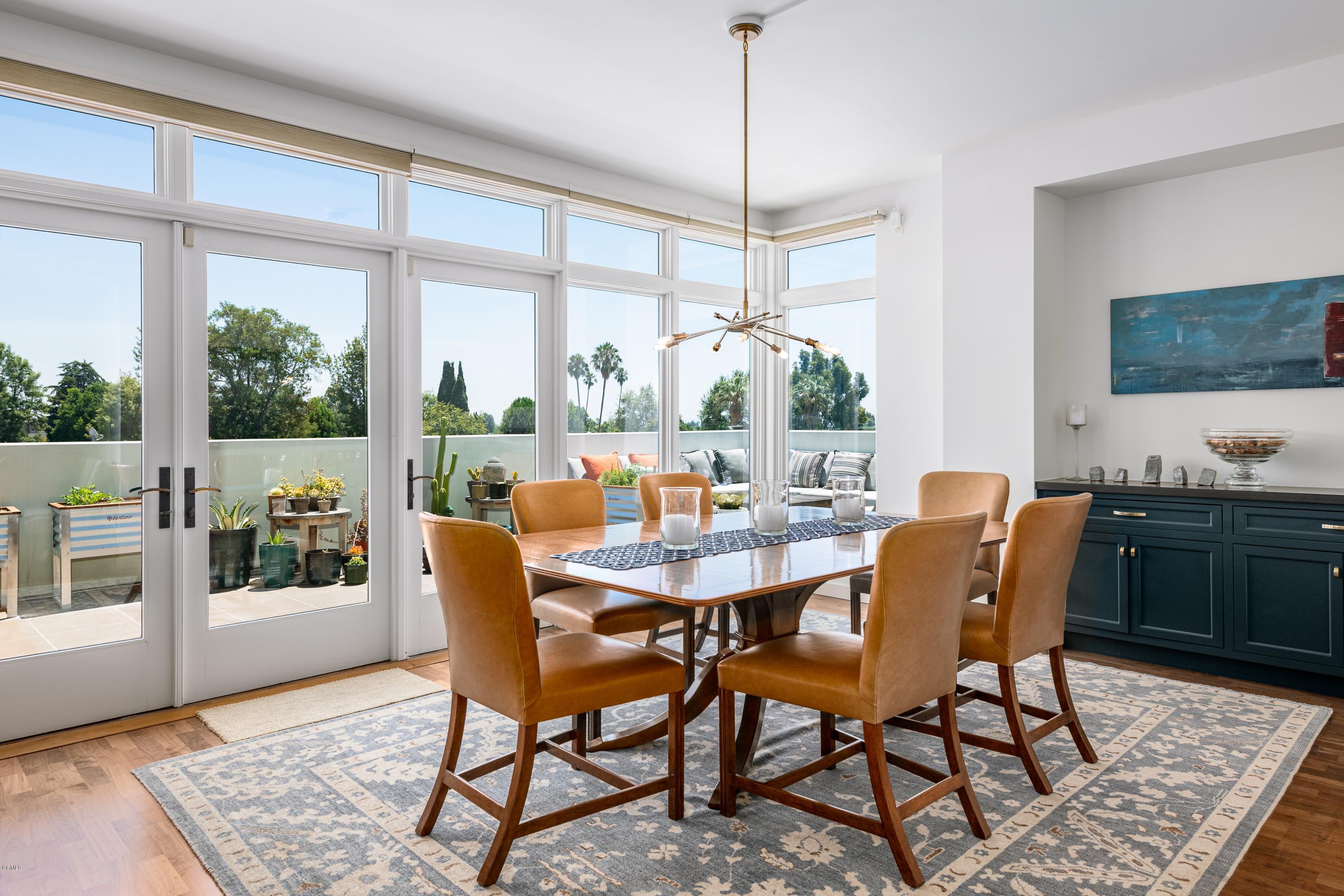 920 Granite Drive, Unit 509 Pasadena, CA 91101 - Photo 11 of 26 a dining room with furniture a chandelier and wooden floor