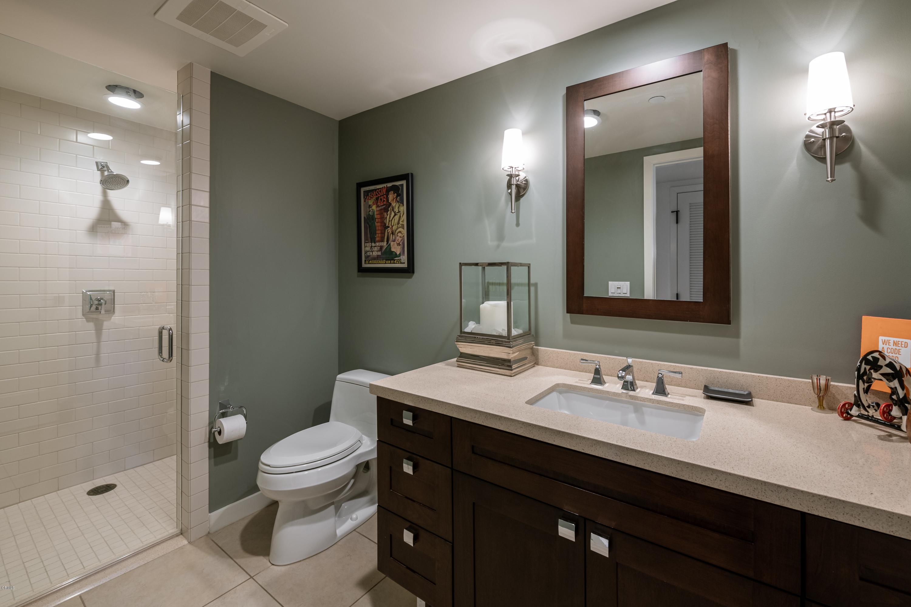 920 Granite Drive, Unit 509 Pasadena, CA 91101 - Photo 12 of 26 a bathroom with a sink a toilet a shower and a mirror
