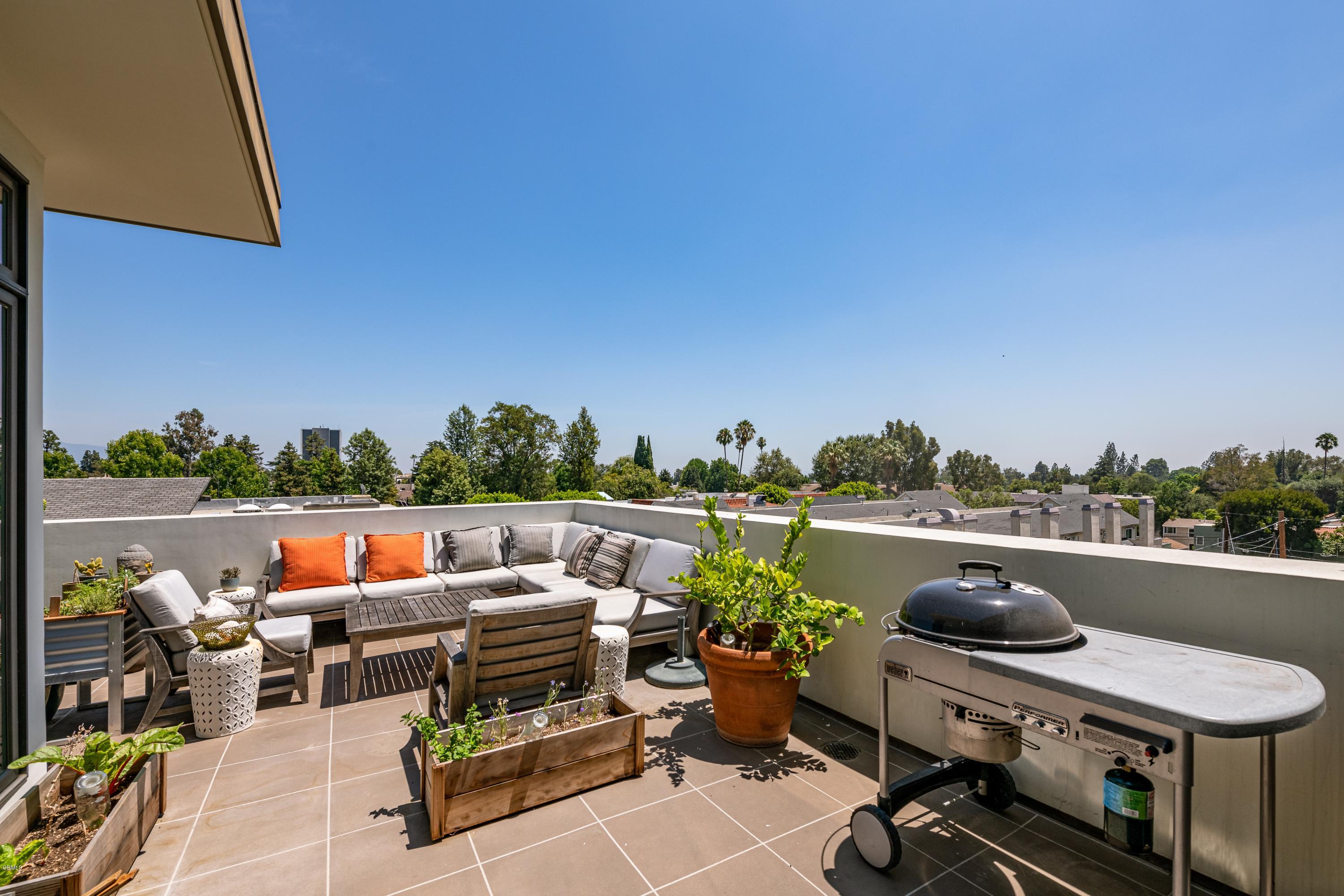 920 Granite Drive, Unit 509 Pasadena, CA 91101 - Photo 22 of 26 a terrace with outdoor seating and city view